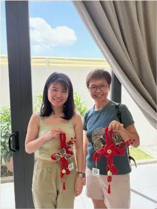 Guests holding handmade craft door gifts